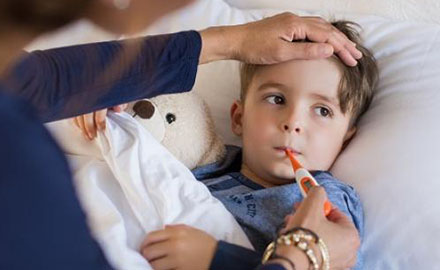 Young boy unwell in bed
