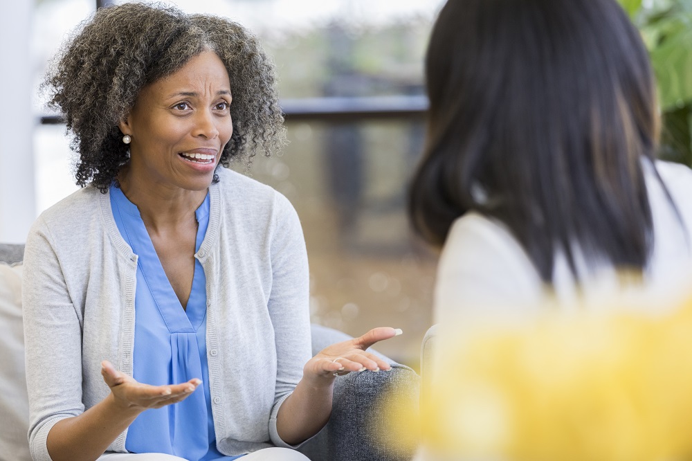 Distraught parent having a conversation with an educator