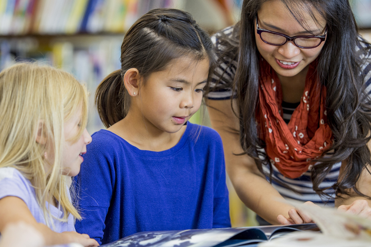 Educator reading with children