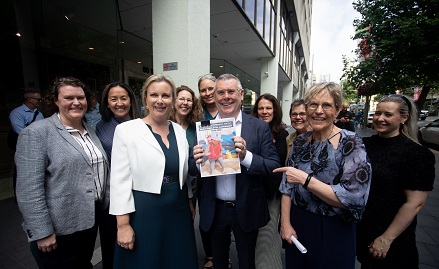 Executive Director at the time, Julie Price, and other advocates at the signing of the multi-employer agreement