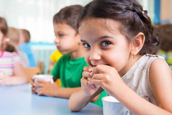 Child eating lunch at the table