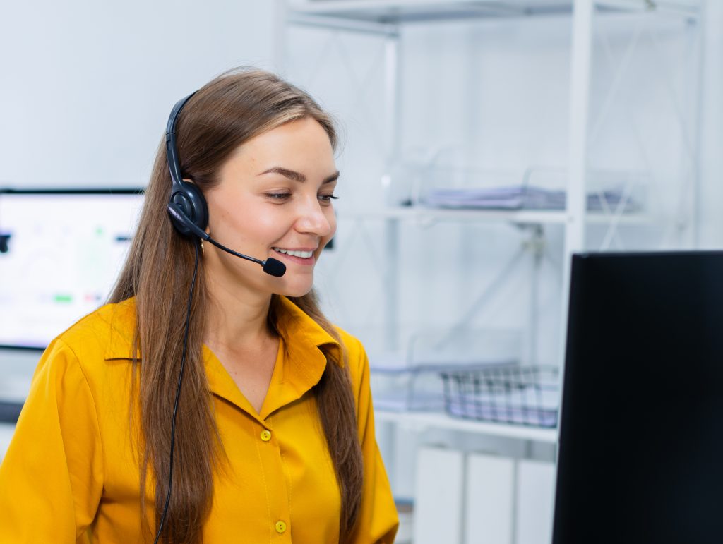 Consultant speaking to service over the phone in an office