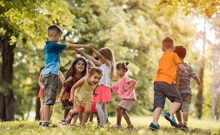 Group of children joyfully playing in a park