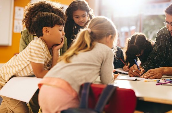 Educator drawing with children