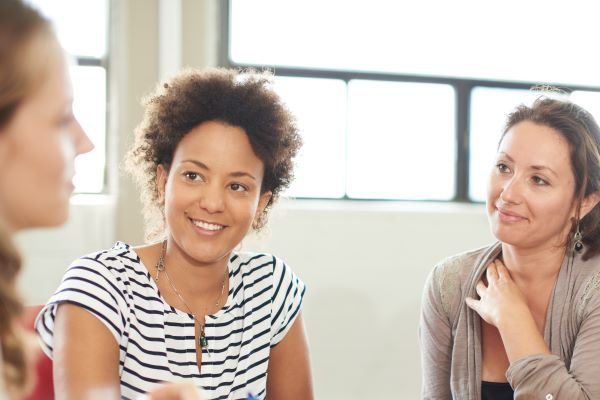 Educators sitting around a table