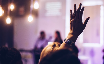 Hand raised at an event